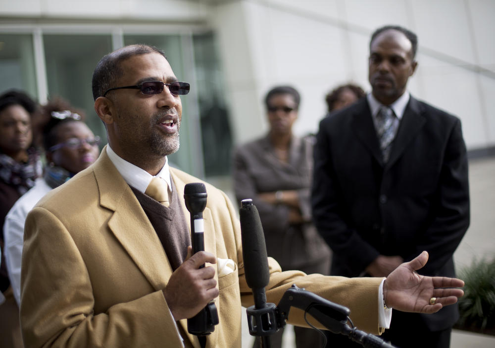 Sapelo Island descendant and land owner Reginald Hall speaks at a news conference outside federal court in Atlanta on Dec. 9, 2015. Hall says people left the island because McIntosh County did not invest much money in essential services for the island.