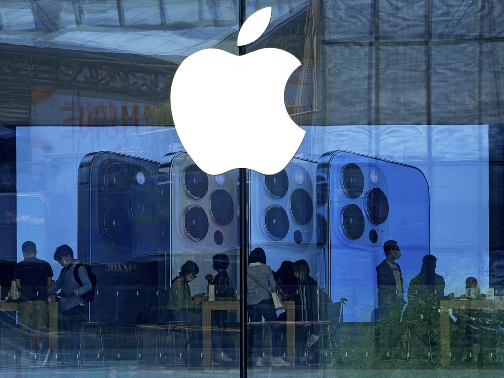 People shop at an Apple Store in Beijing on Sept. 28, 2021. Apple has disclosed serious security vulnerabilities for iPhones, iPads and Macs that  could potentially allow attackers to take complete control of these devices.