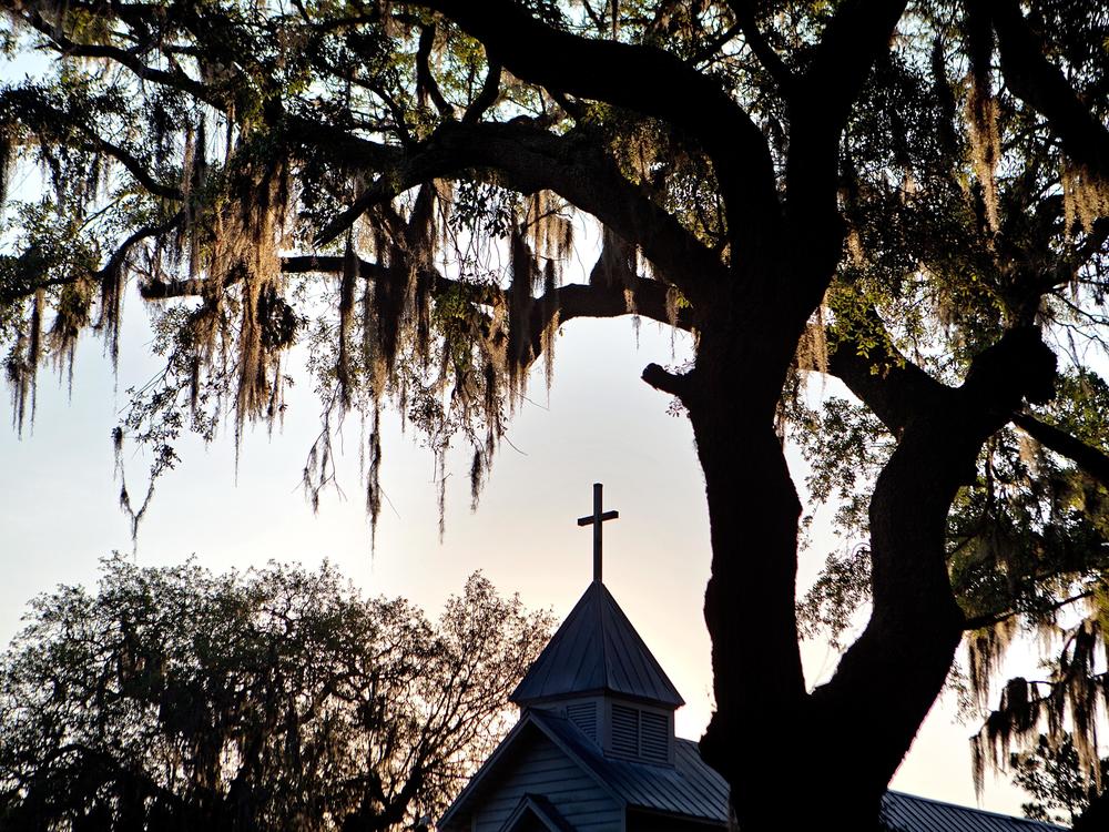 The sun rises behind St. Luke Baptist Church in Hog Hammock, a Geechee community on Sapelo Island, Ga., on May, 17, 2013.