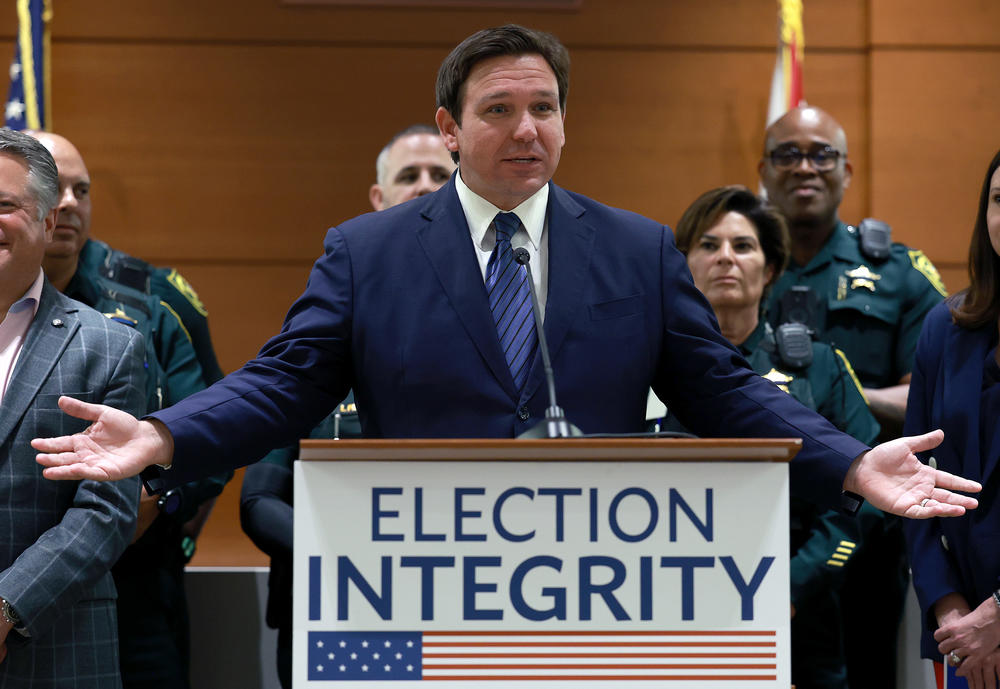 Florida Gov. Ron DeSantis speaks during a press conference Thursday in Fort Lauderdale, where he announced that the state's new Office of Election Crimes and Security is in the process of arresting 20 individuals across the state for voter fraud.