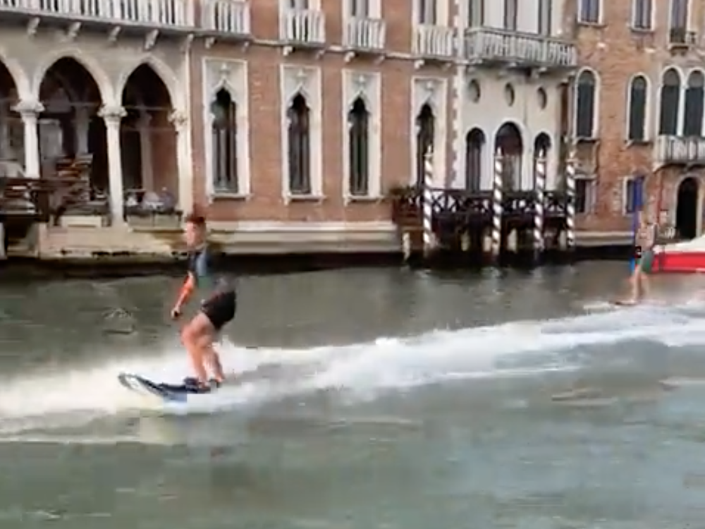 The mayor of Venice, Italy, mobilized a search for two people who used motorized surfboards to cruise down the picturesque city's canals. Now the pair are facing large fines.