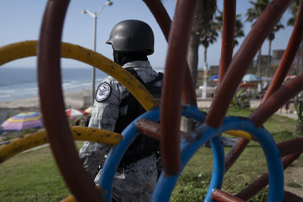 A member of the National Guard patrols Playas de Tijuana.