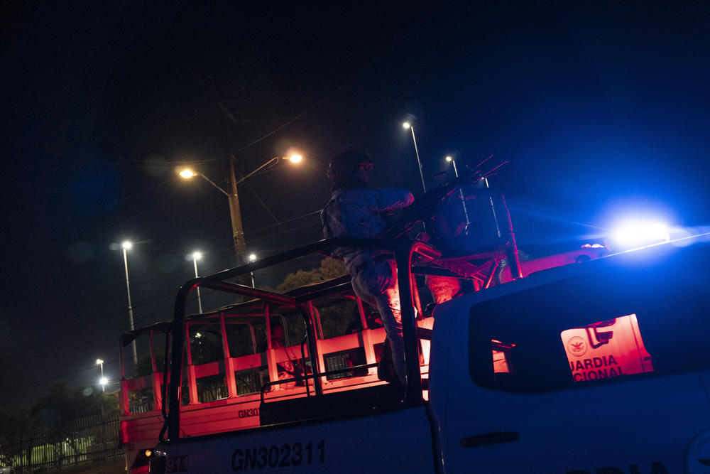 A member of the National Guard stands watch over the Gran Tenochtitlan neighborhood of Tijuana.