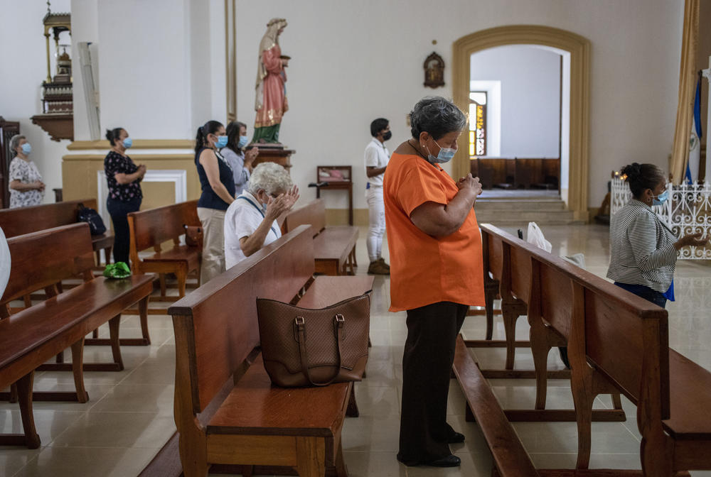 Faithful attend a Mass at the Cathedral in Matagalpa, Nicaragua, on Friday. Nicaraguan police on Friday raided the residence of Matagalpa Bishop Rolando Álvarez, detaining him and several other priests in an escalation of tensions between the Catholic Church and the government of Daniel Oretga.