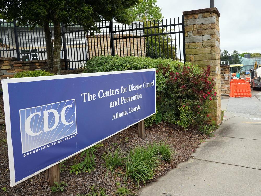 A sign is seen by the entrance of the Centers for Disease Control and Prevention in Atlanta on April 23, 2020. The CDC said it is investigating an <em>E. coli</em> outbreak in four states that has sickened at least 37 people.
