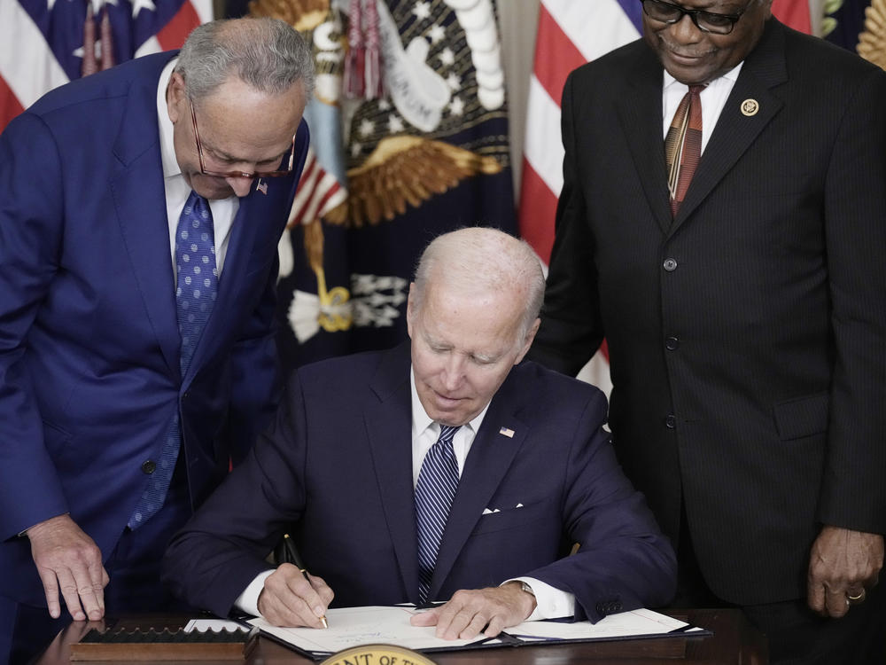 President Biden signs The Inflation Reduction Act with Democratic Senate Majority Leader Charles Schumer from N.Y. and Democratic House Majority Whip James Clyburn from South Carolina in the White House on Aug. 16.