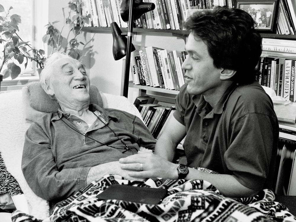 Mitch Albom and Morrie Schwartz hold hands on Oct. 3, 1995.