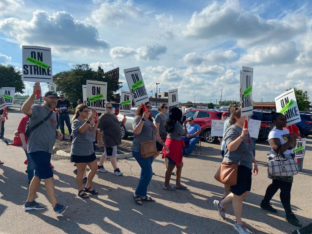 Members of the Columbus Education Association rally earlier this summer ahead of their vote this past Sunday night to officially strike this week.