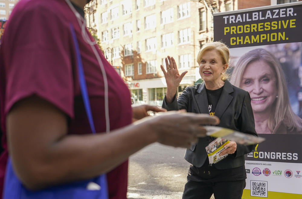 Rep. Carolyn Maloney greets a voter while campaigning on the Upper East Side neighborhood of Manhattan on Aug. 16. Maloney is running against attorney Suraj Patel and Rep. Jerry Nadler in New York's 12th District Democratic primary.