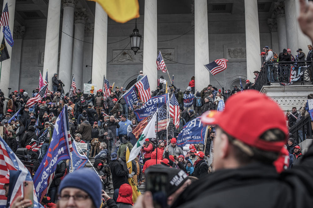 Supporters of President Donald Trump take the steps on the east side of the U.S. Capitol on Jan. 6, 2021.