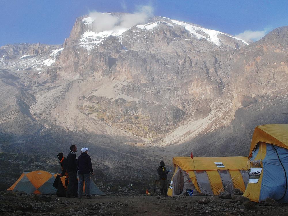 Hikers stand by tents along a trekking route on Mount Kilimanjaro in 2014. The Tanzanian government has installed high-speed internet service on the slopes of the mountain.