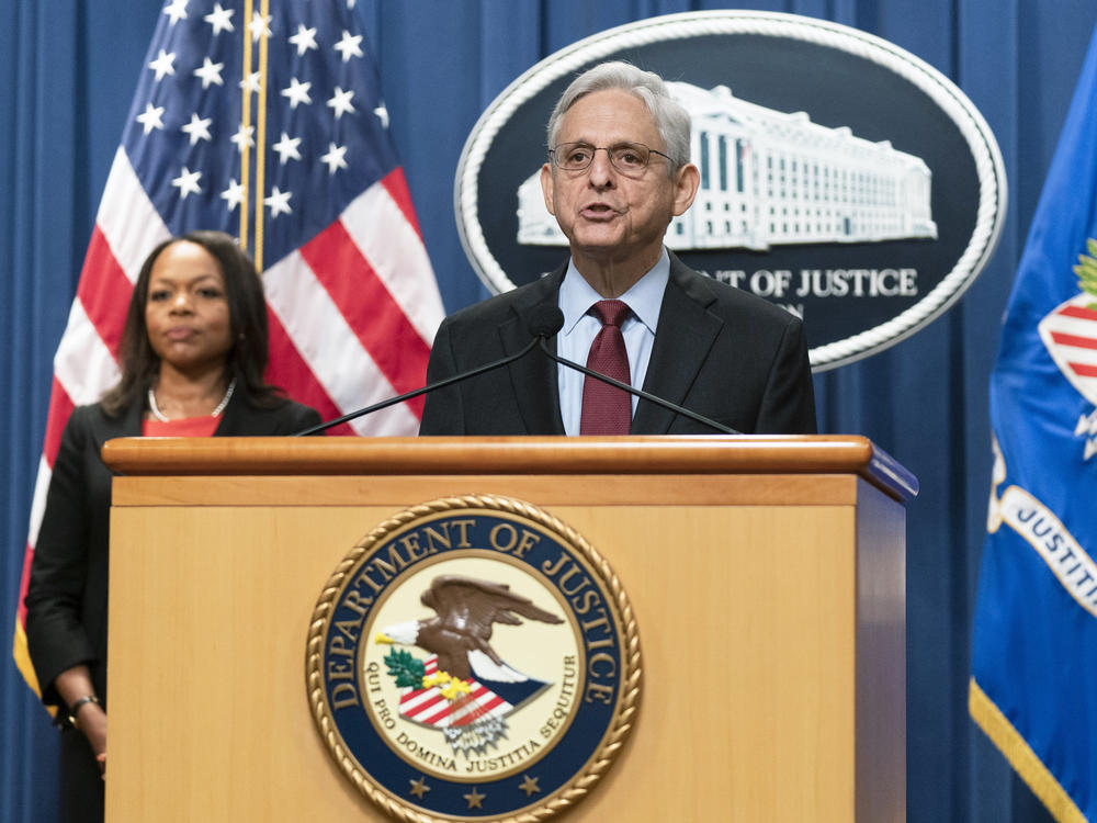 Attorney General Merrick Garland with Assistant Attorney General Kristen Clarke for the Civil Rights Division, speaks during a news conference at the Department of Justice in Washington, on Aug. 4.