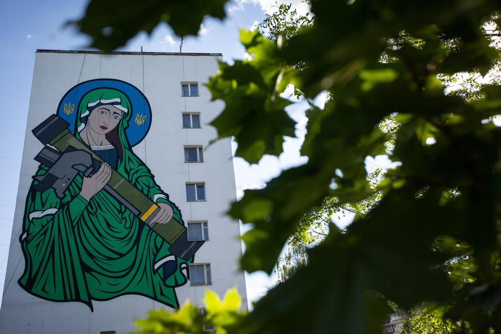 A mural known as St. Javelin — showing a meme of the Virgin Mary cradling a U.S.-made anti-tank Javelin launcher — on the wall of an apartment building in Kyiv on May 24.
