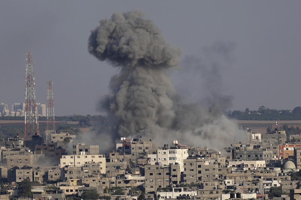 Smoke rises after Israeli airstrikes on a residential building in Gaza, Sunday, Aug. 7.