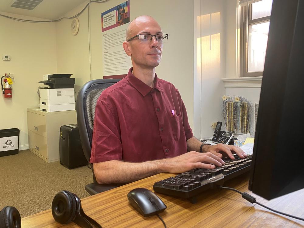 Call center specialist Michael Colluccio works on a team that answers 988 calls from people whose phones have area codes for the suburban Philadelphia region. If needed, Colluccio also can answer calls from other parts of the state or country, part of a system that makes sure someone is always available to talk.
