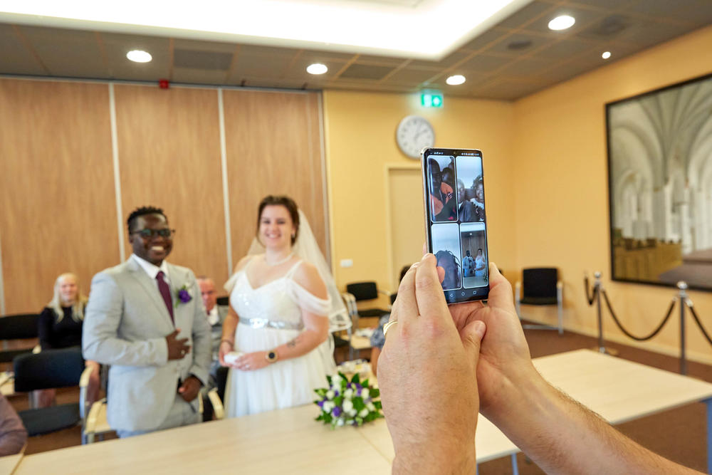 The wedding ceremony lasted 5 minutes. Patrick's family from Malawi watched via video call.