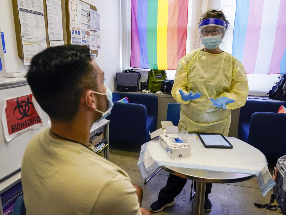 Physician Assistant Susan Eng-Na, right, administers a monkeypox vaccine during a vaccination clinic in New York. New cases are starting to decline in New York and some other U.S. cities.