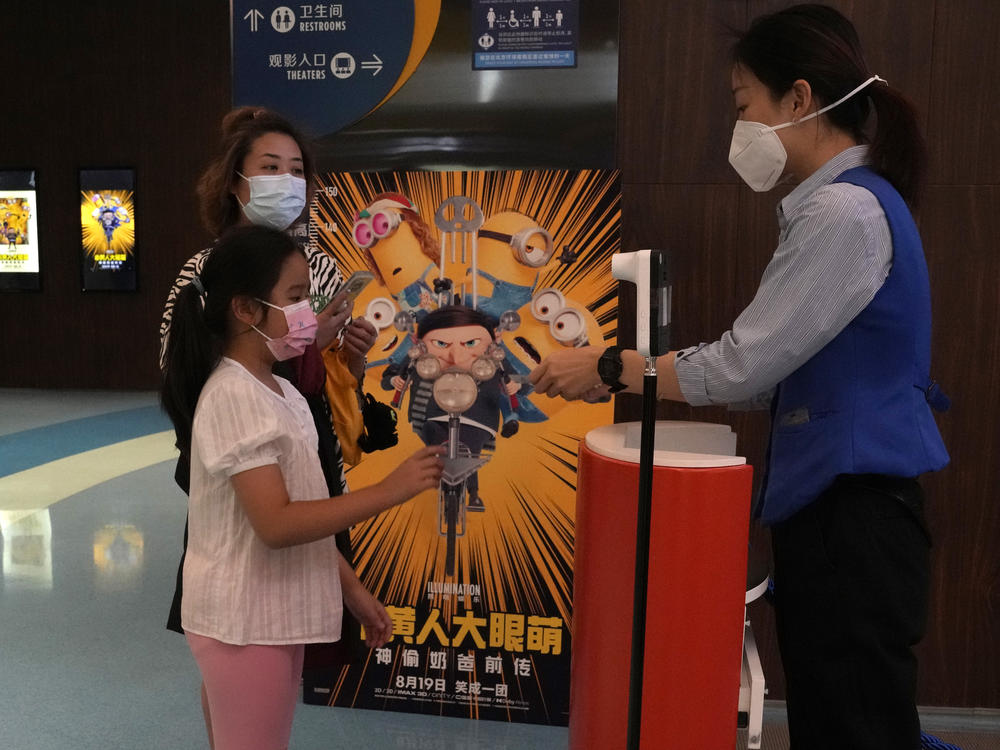 Visitors to a cinema showing the latest 