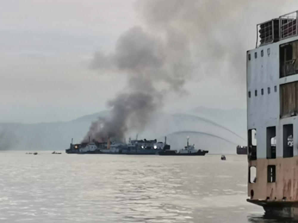 In this handout photo provided by the Philippine Coast Guard, smoke is seen from the M/V Asia Philippines, an inter-island cargo and passenger vessel, as it caught fire while it was approaching Batangas port, southern Philippines on Friday.