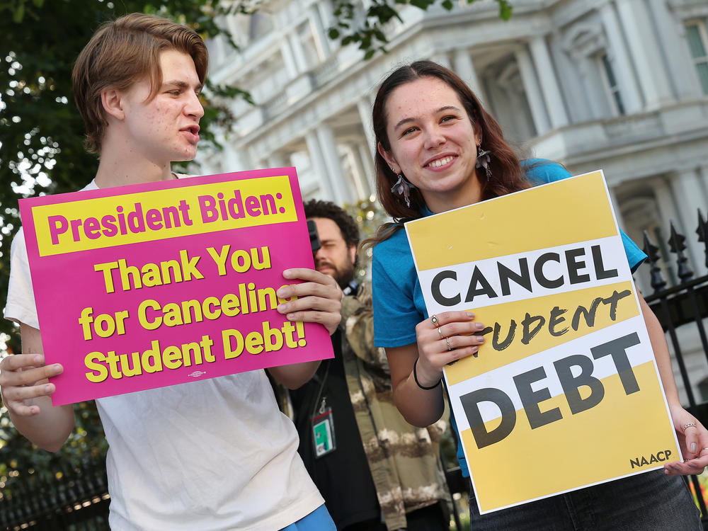Student loan borrowers stage a rally in front of The White House on Aug. 25 to celebrate President Biden cancelling student debt. The plan has sparked heated debate, including about its economic fairness.