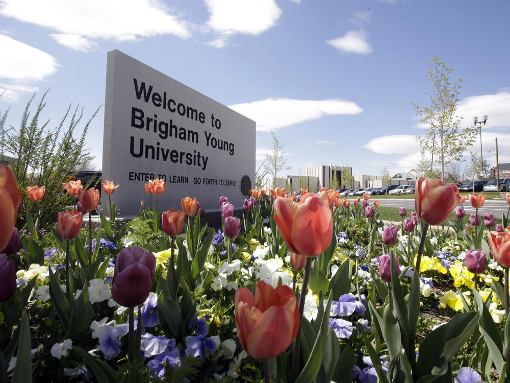 This April 19, 2016, file photo, shows a welcome sign to Brigham Young University in Provo, Utah. BYU says it has banned a fan that yelled racist slurs at a Duke University volleyball player this weekend.