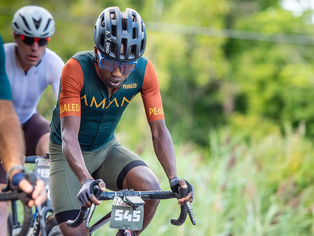 In this photo provided by Joseph Viger, Kenyan cyclist Sule Kangangi cycles at a gravel race in Vermont, Saturday, Aug. 27, 2022.