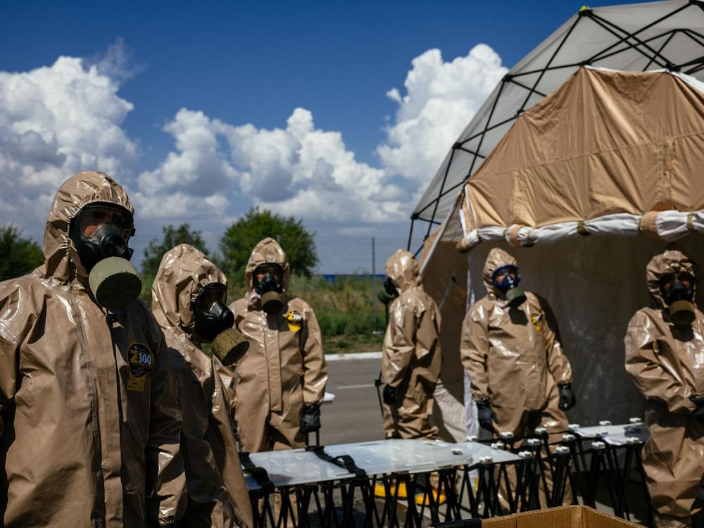 Ukrainian Emergency Ministry rescuers attend an exercise in the city of Zaporizhzhia on Aug. 17, in case of a possible nuclear incident at the Zaporizhzhia nuclear power plant located near the city. The plant in southern Ukraine came under Russian occupation in the early days of the war.