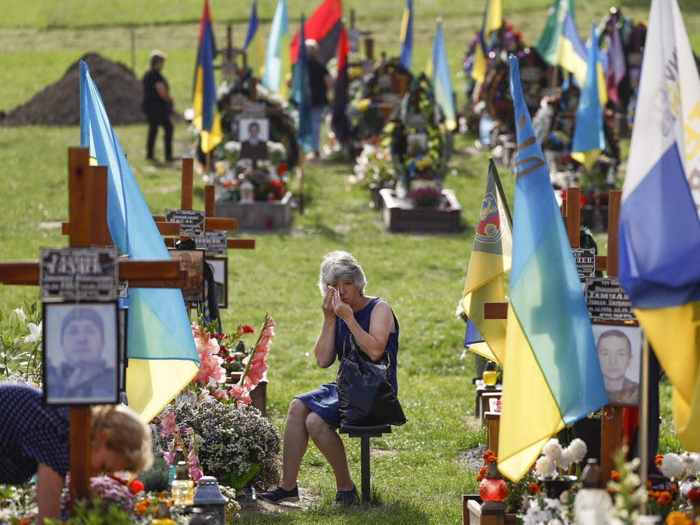 People attend a ceremony for the fallen soldiers of Ukraine on the Field of Mars on Aug. 24 in Lviv, Ukraine. The day marked six months since the start of Russia's large-scale invasion of Ukraine, as well as Ukraine's Independence Day.