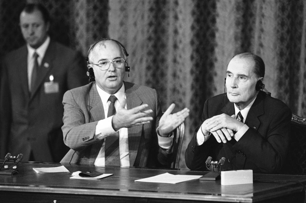 Soviet leader Mikhail Gorbachev gestures during a joint news conference with French President François Mitterrand who appeared to be supporting Gorbachev's proposal to the U.S. to ban weapons in space, but also rejected the Soviet leader's offer of direct disarmament talks with France at the Elysee Palace in Paris, Oct. 4, 1985.