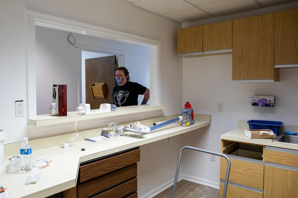 Ariel walks past what will be the nurses' station at the Partners in Abortion Care clinic. Even with abortion bans, she says, 