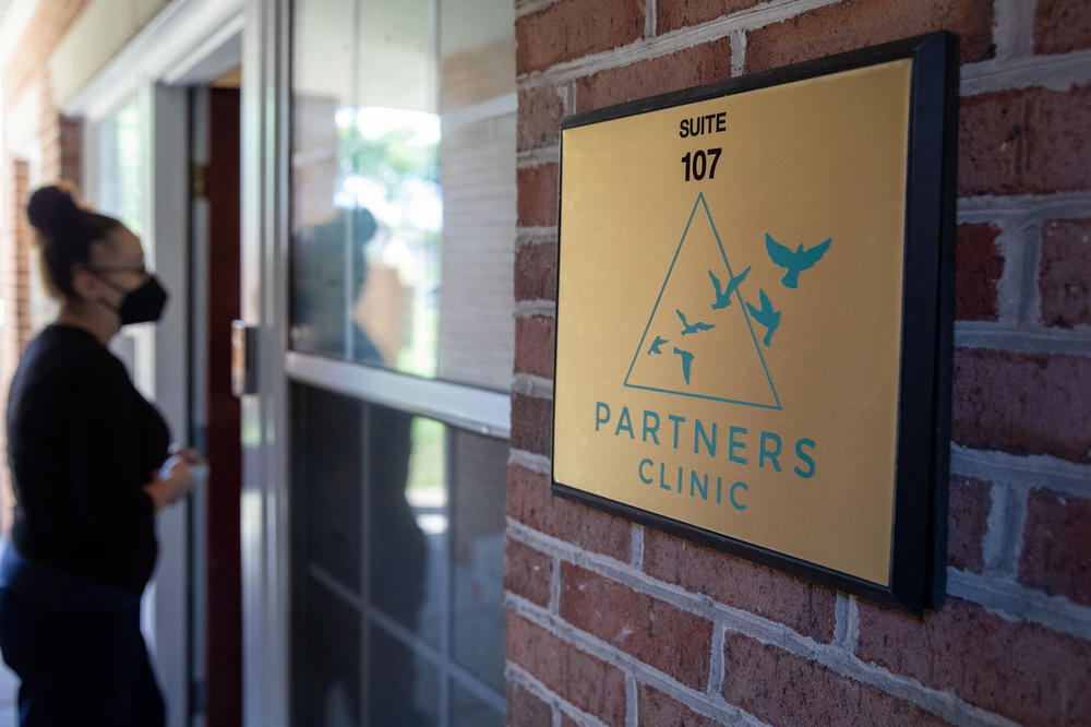 Patient care technician Megan walks into the clinic. Co-owner Diane Horvath says the birds in the logo are 