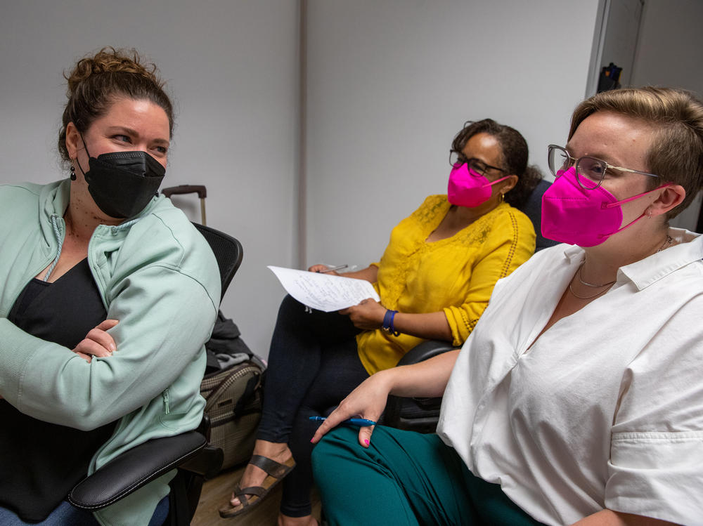 Partners in Abortion Care co-owners Dr. Diane Horvath (l) and Morgan Nuzzo (r) meet with chief operating officer Kim Lee-Wilkins in their clinic in College Park, Md.