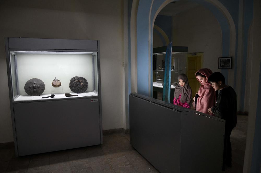 Visitors take in a display at Afghanistan's National Museum soon after it reopened in December.