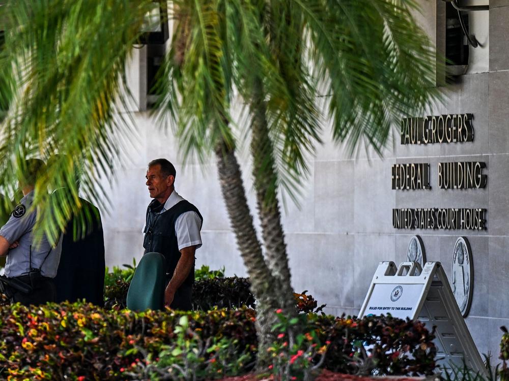 Security officers guard the entrance to the Paul G. Rogers Federal Building & Courthouse as the court holds a hearing to determine if the affidavit used by the FBI as justification for last week's search of Trump's Mar-a-Lago estate should be unsealed, at the U.S. District Courthouse for the Southern District of Florida in West Palm Beach on Aug. 18.
