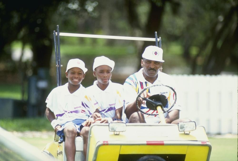 <strong>1992:</strong> Serena Williams and her sister Venus Williams ride with their father Richard Williams at a tennis camp in Florida.