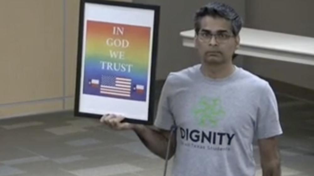 Srivan Krishna holds a rainbow-themed 