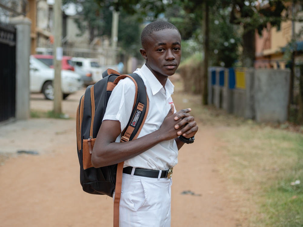 Kusemererwa Jonathan Henry, 16, runs a fruit-and-vegetable stand that is helping pay school fees. He wants to be an electrical engineer.
