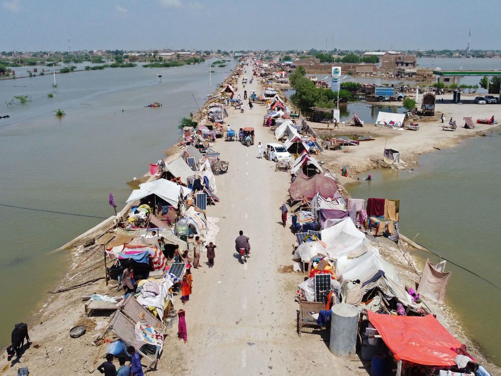 An aerial photo taken Wednesday shows people sheltering in a makeshift camp after heavy monsoon rains in the Jaffarabad district of Pakistan's Balochistan province.