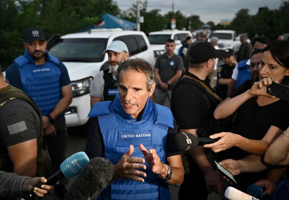 International Atomic Energy Agency chief Rafael Mariano Grossi talks to the press on a road outside Zaporizhzhia city after his visit to the Russian-held nuclear power plant in southern Ukraine on Thursday.