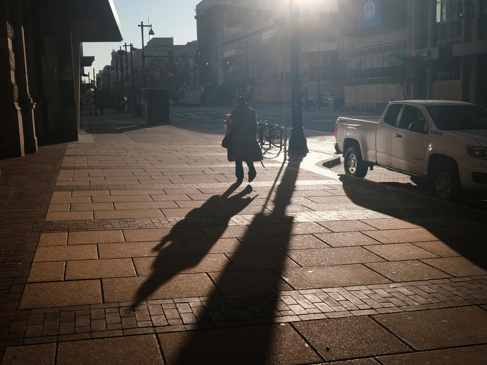 A person walks down a street in Philadelphia, Pa.