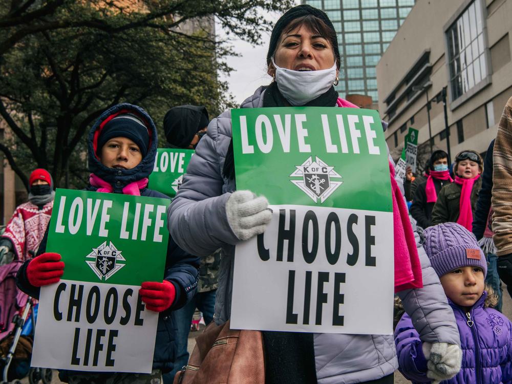 Anti-abortion demonstrators participate in the Texas March for Life on January 15, 2022 in Dallas, Texas.
