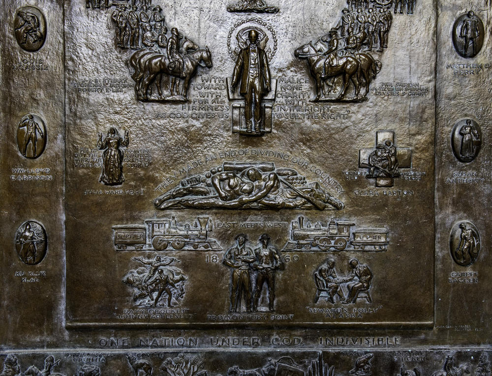 A closer view of the panel that includes an image of a Ku Klux Klan member.
