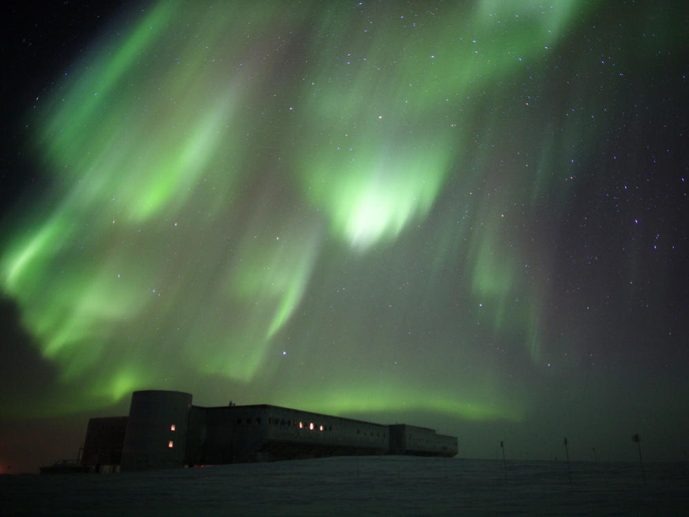 The aurora australis over Amundsen-Scott South Pole Station in 2009. A new report from the National Science Foundation finds sexual harassment and assault are a major problem at remote facilities.