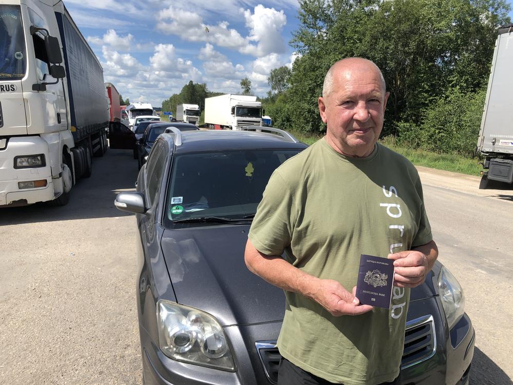 Anatoly Chibaterevsky waits to cross the border from Terehova, Latvia, into Russia to attend his brother's funeral in Volgograd in southwest Russia, Aug. 3. Chibaterevsky is one of tens of thousands of 