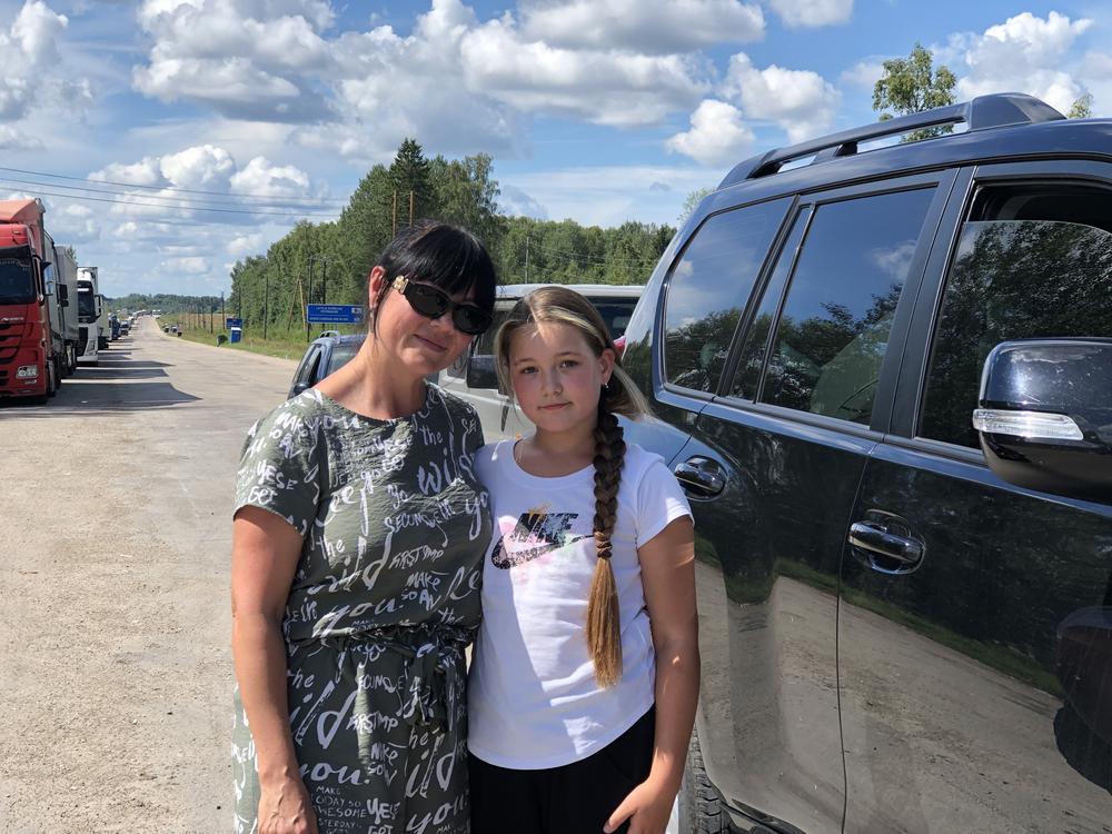 Ukrainian Natalia Kononenko and her daughter wait to enter Russia from Terehova, Latvia, on Aug. 3. Kononenko is on a rescue mission to pull her son out of the Donetsk region. Instead of driving a few hundred miles through the fighting on the front line and risking getting killed, she's driving thousands of miles, circumnavigating Ukraine, so that she can approach Donetsk from Russia.