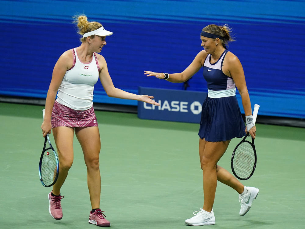 Lucie Hradecká, right, and Linda Nosková, of the Czech Republic, celebrate during their first-round doubles match against Serena Williams and Venus Williams at the U.S. Open tennis championships.