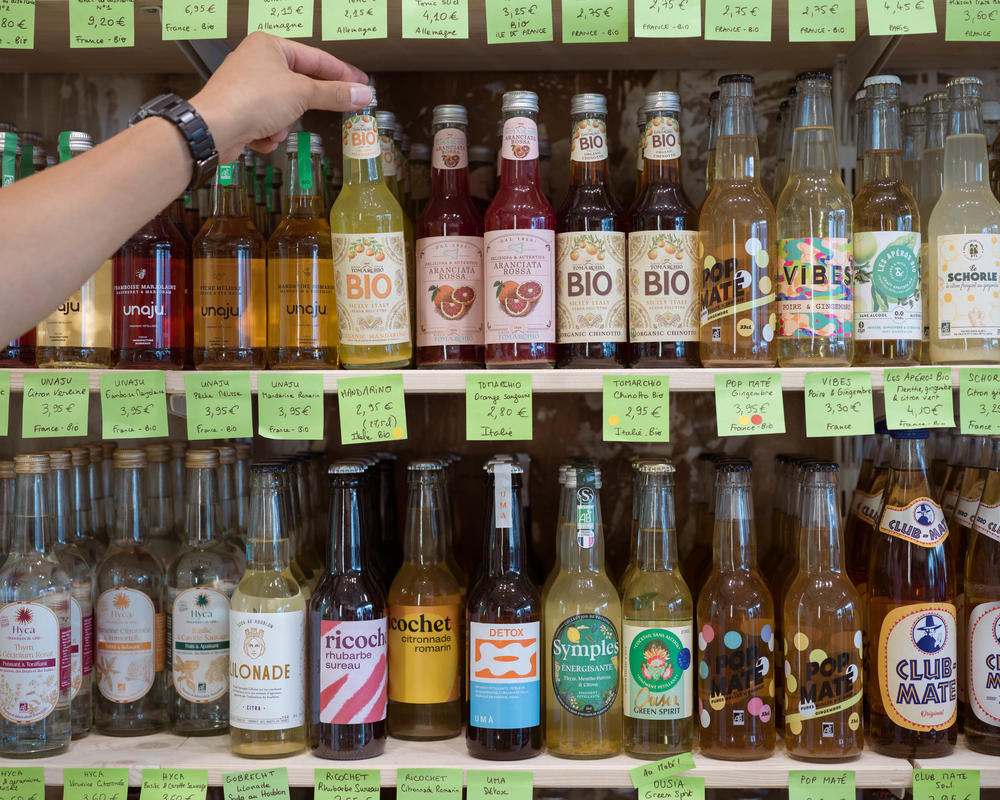 A customer grabs a non-alcoholic drink at Le Paon Qui Boit in Paris on Aug. 26.