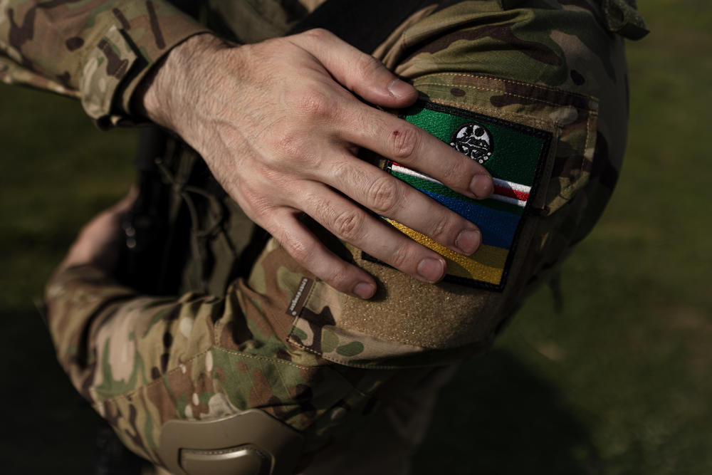 A Chechen volunteer soldier displays a patch with the flags of both the Chechen Republic of Ichkeria and Ukraine in an undisclosed location in Ukraine on July 7.