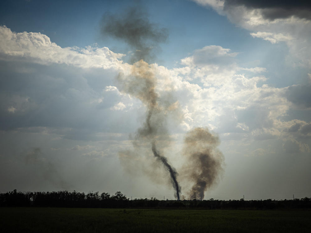 Black smoke rises at the front line in southern Ukraine's Mykolaiv Oblast on Aug. 30 amid Russia's military invasion of the country. Ukraine has begun a major counteroffensive to retake areas in the south that Russia seized early in the war.