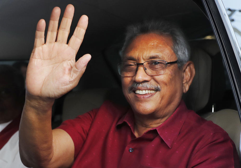 In this file photo, then-Sri Lankan President-elect Gotabaya Rajapaksa waves to supporters as he leaves the election commission after the announcement of his victory in Colombo, Sri Lanka, on Nov. 17, 2019.